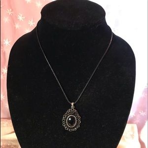 Black pendant on 18 inch silver tone chain